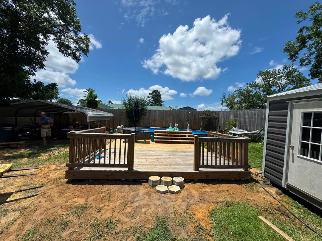 Completed raised wood deck viewed from the yard