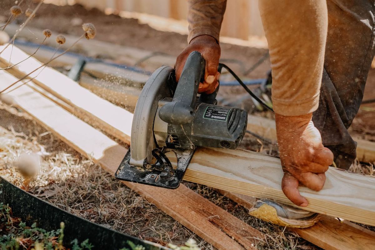 Wooden planks being cut with a circular saw